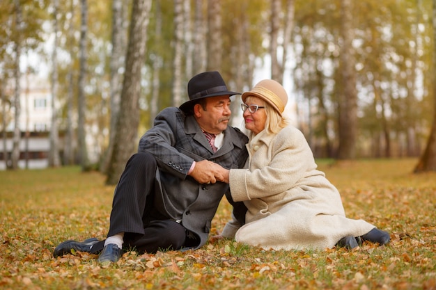 Elderly couple in the autumn park