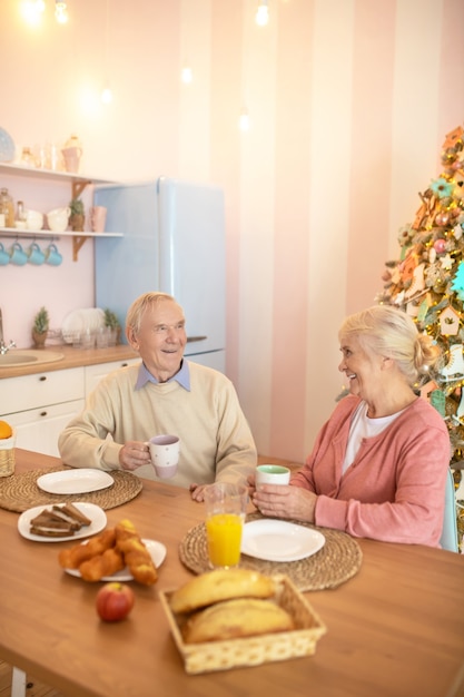 Elderly couple having breafast