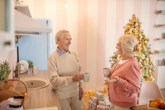 Elderly couple having morning tea