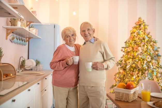 Elderly couple having morning tea