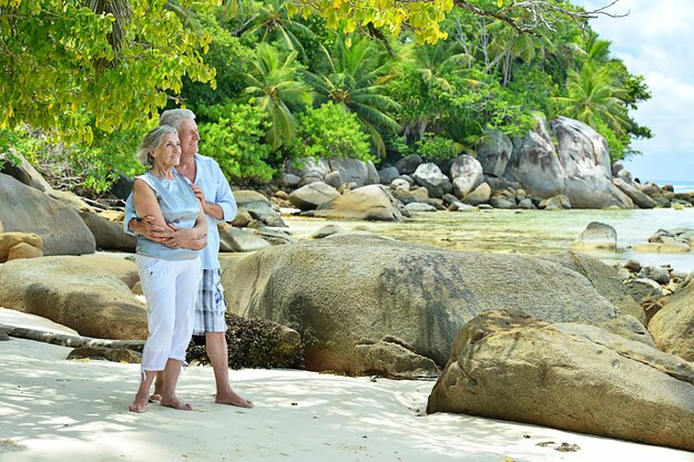 Elderly couple rest at tropical resort