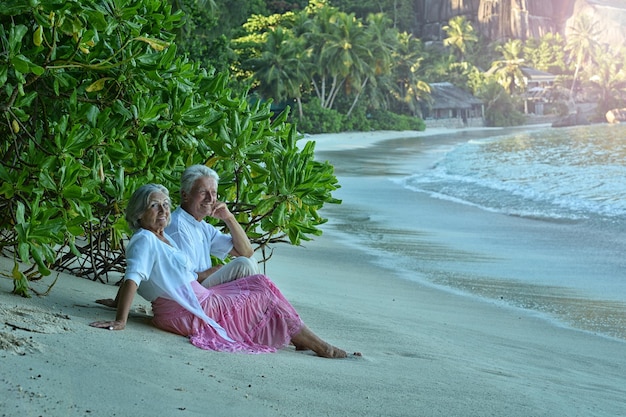 Elderly couple rest at tropical resort