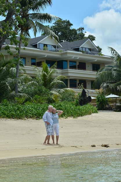 Elderly couple at tropical beach