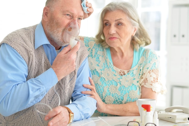 Elderly couple with pills