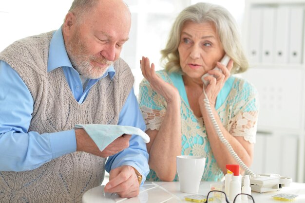 Elderly couple with pills