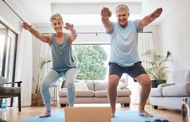 Elderly couple and yoga in home with laptop for training with video online Man woman and retirement with computer for class on internet together in living room for health wellness and fitness