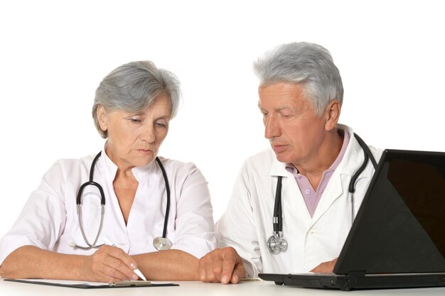 Elderly doctors with a laptop