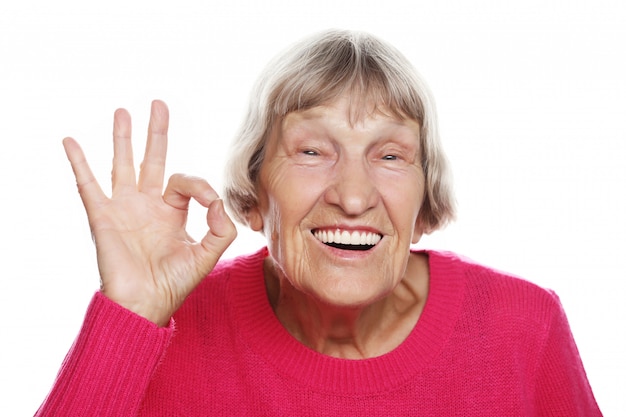 Elderly happy woman giving okay