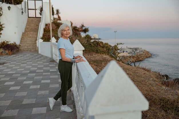 Elderly lady enjoying beautiful nature of park