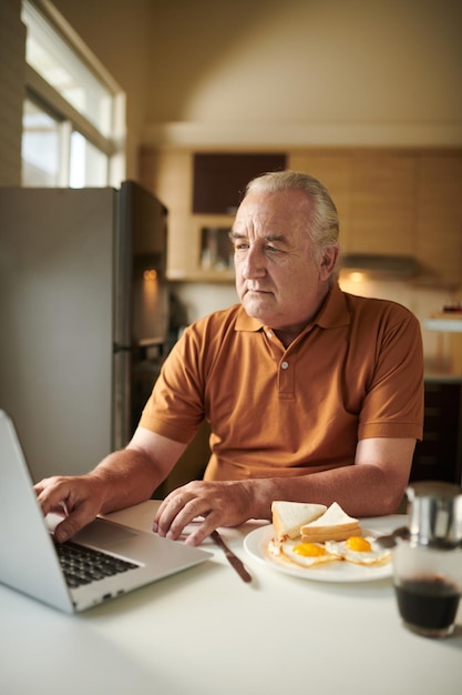 Elderly Man Checking Social Media