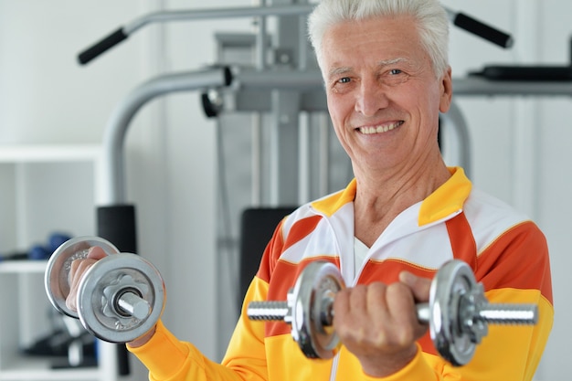 Elderly man in a gym during exercise