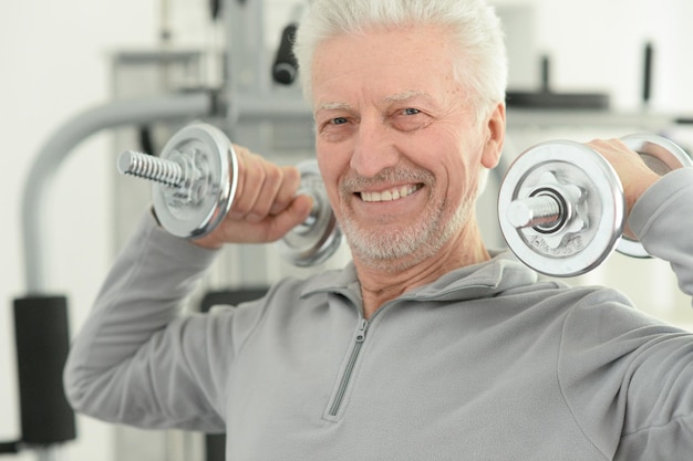 Elderly man in a gym during exercise