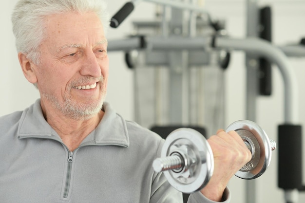 Elderly man in a gym during exercise