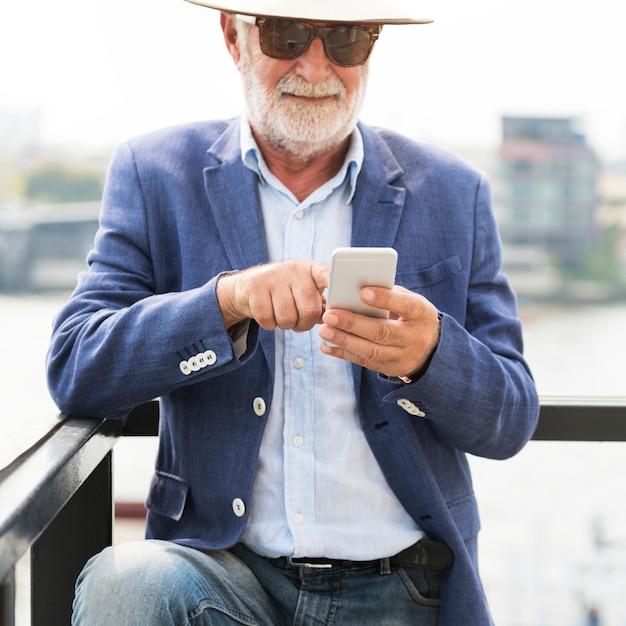 Elderly man is using mobile phone