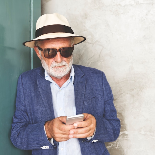 Elderly man is using mobile phone