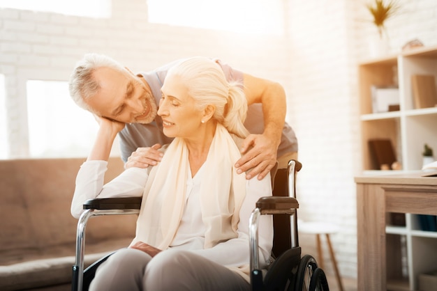 Elderly man is visiting to nursing home. Happy together.