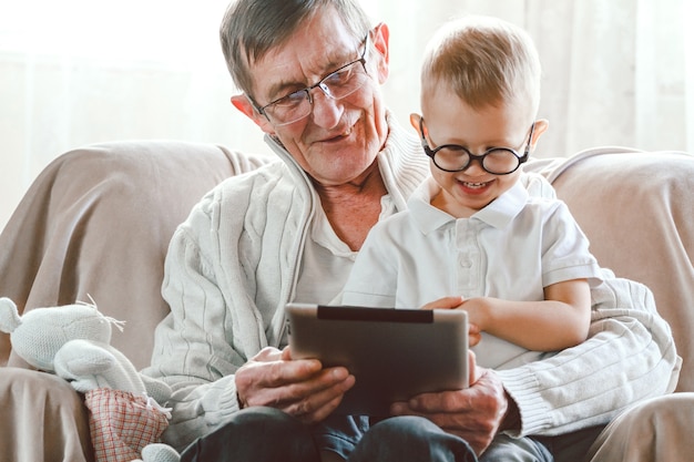 Elderly man playing with his nephew