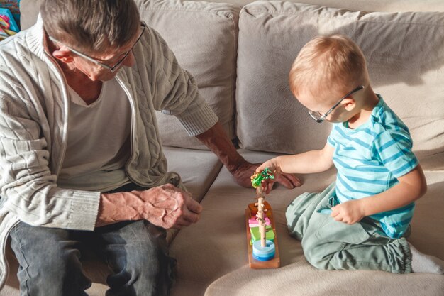 Elderly man playing with his nephew