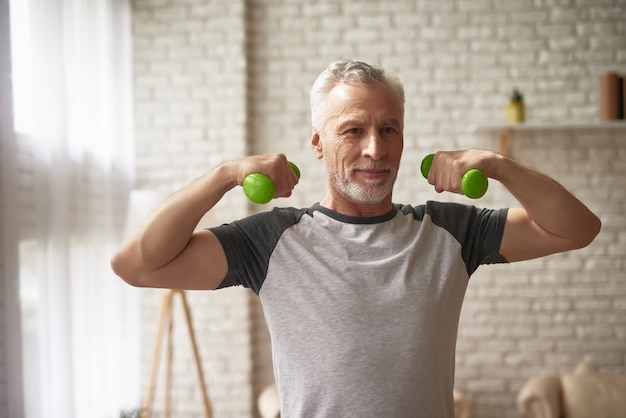 Elderly Man Training Bicep Dumbbells Exercises