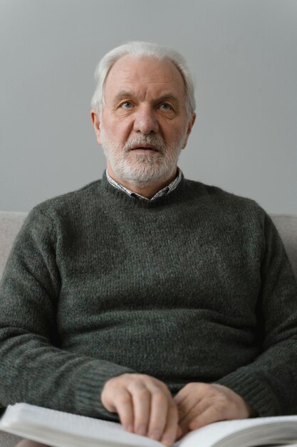 Elderly Man Using a Braille Photo