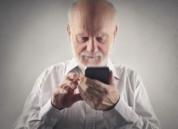 Elderly man using a smartphone