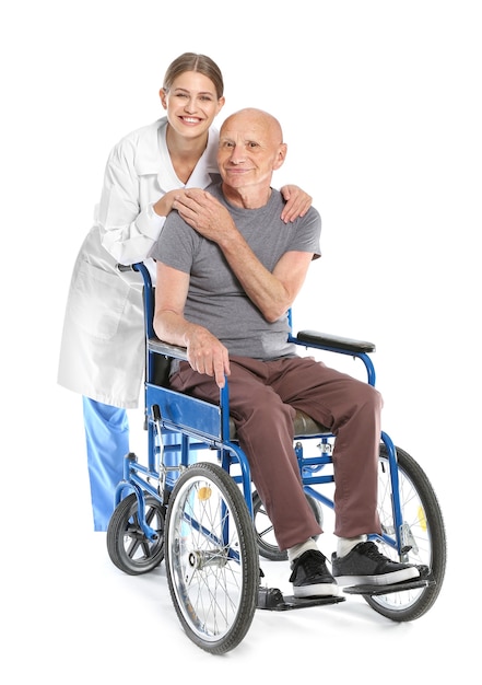 Elderly man with doctor on white