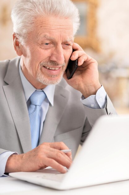 Elderly man with phone