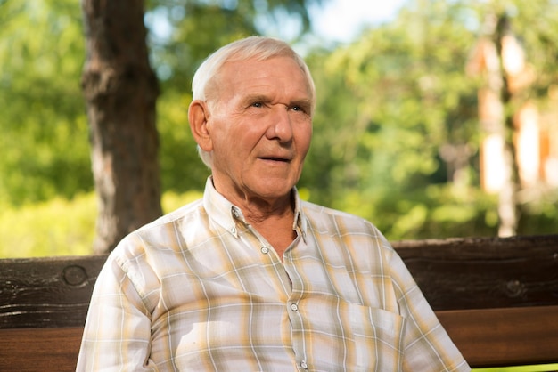 Elderly man with thoughful face portrait of senior male time runs like water live in peace with your