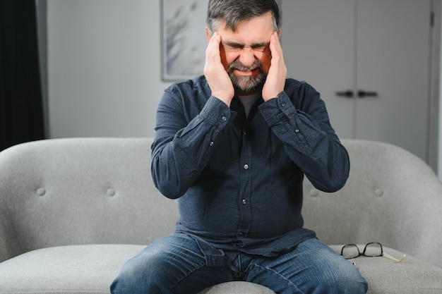 Elderly men with headache indoor