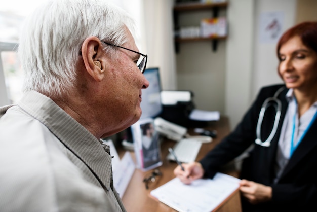 An elderly patient meeting doctor at the hospital