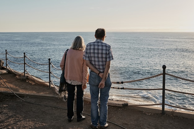 Elderly seniors couple is resting on the sea resort