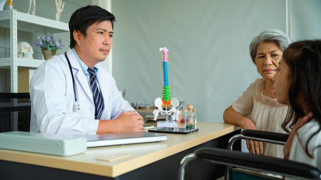 Photo elderly woman brought her daughter to see a surgeon at the hospital