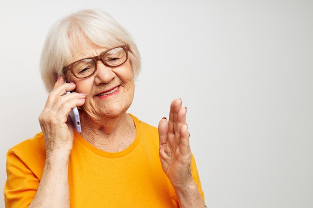 Elderly woman happy lifestyle in yellow tshirts closeup emotions