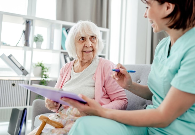 Elderly woman and nurse