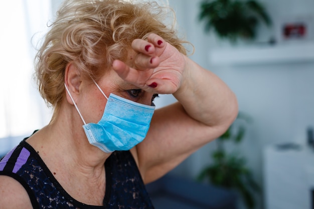 elderly woman in a protective mask