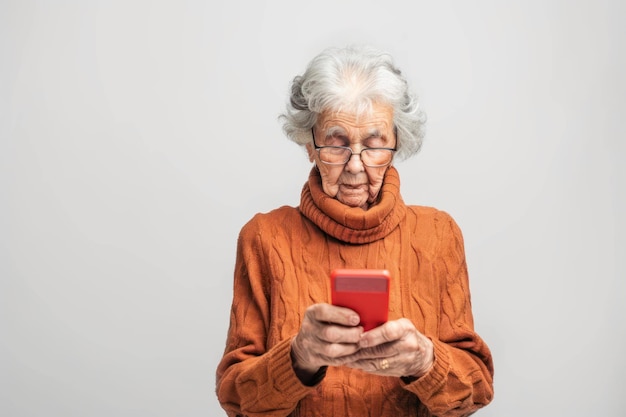 Elderly woman use smartphone in browsing wireless Internet