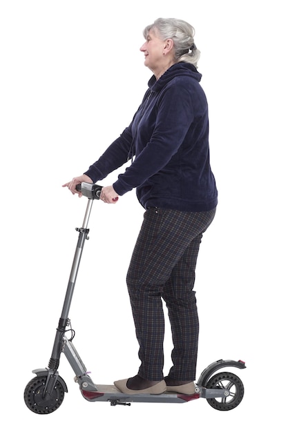Elderly woman with an electric scooter looking at a white screen