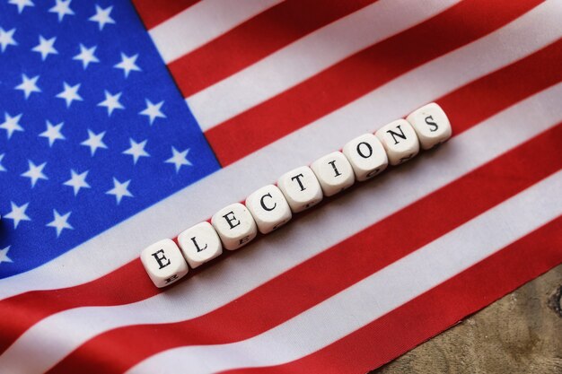 Election simbol on usa flag with letter wooden cubes