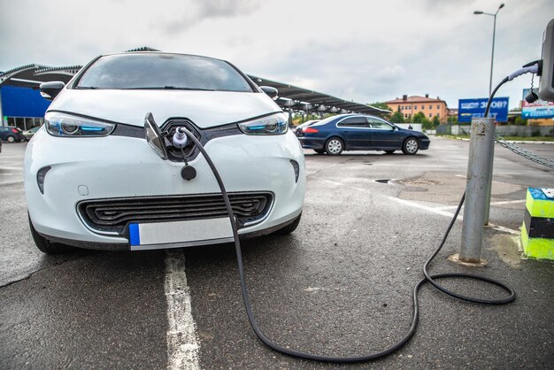 Electric car charging at parking near mall