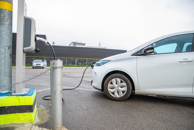 Electric car charging at parking near mall