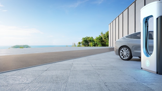 Electric car on concrete floor near charging station in eco friendly and clean energy concept