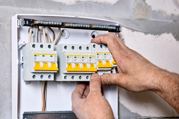 Electric distribution board consumer unit with fuse box or circuit breaker electrical work to