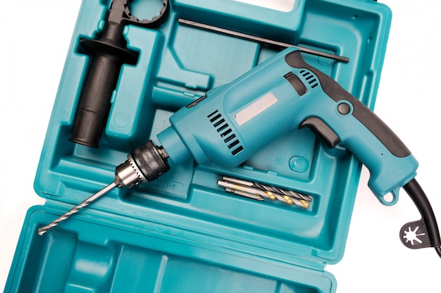 Electric drill in a toolbox