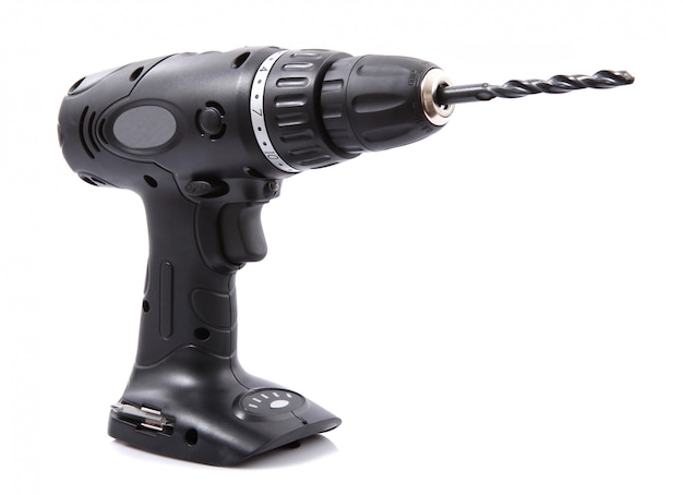Electric drill on a white 