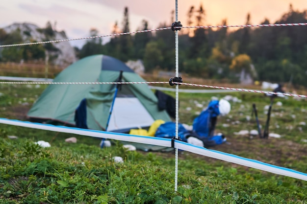 Electric fence encloses the tourist camp in the nature reserve, preventing bear attacks