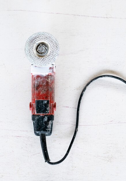 Electric grinding machine on a white background.