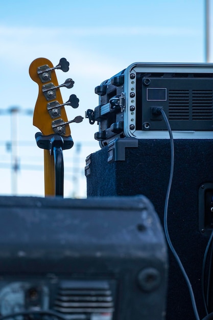 Electric guitar leaning on a small amplifier