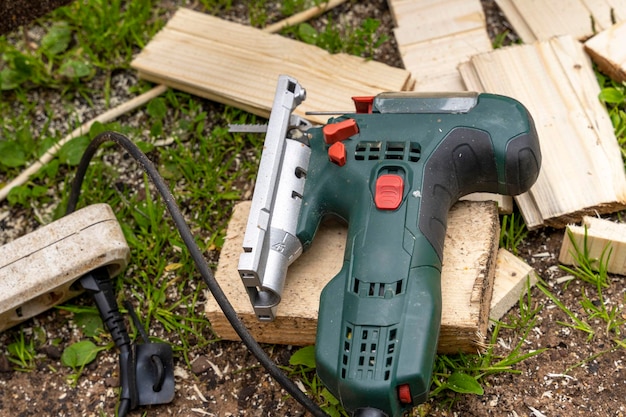 Electric jigsaw woodworking power tools wooden boards\
workshop
