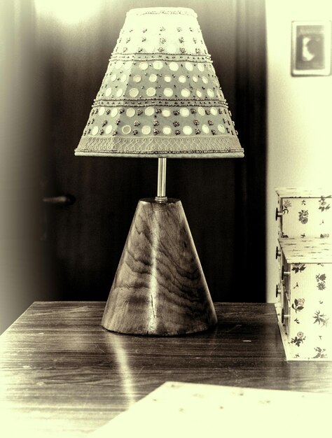 Photo electric lamp on table at home