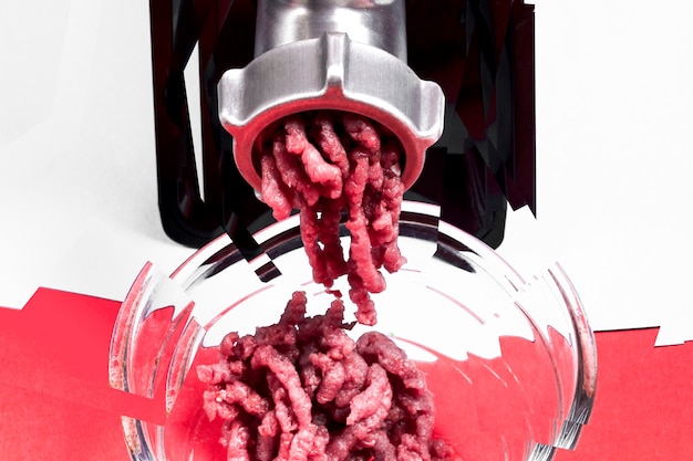 Electric meat grinder with meat